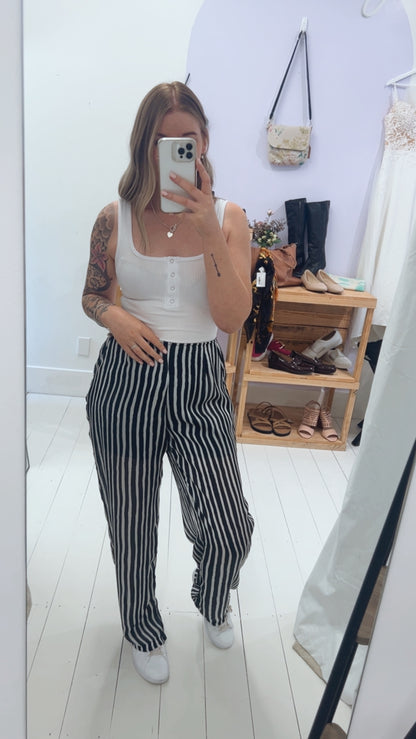 Some kind black and white striped dress pants 12